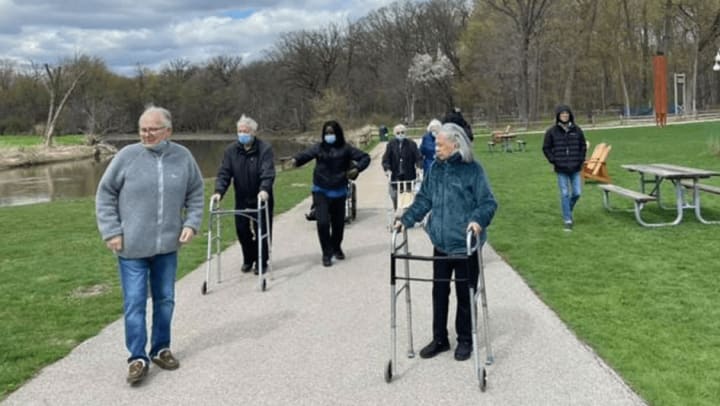 Highline Place Memory Care Littleton, Colorado residents walking