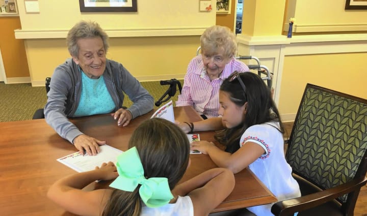 Highline Place residents talking with school kids