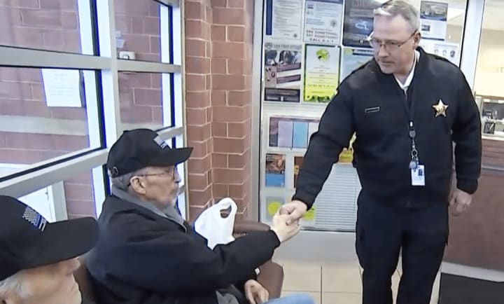 Retired police office and Porter Place resident visits the local police station