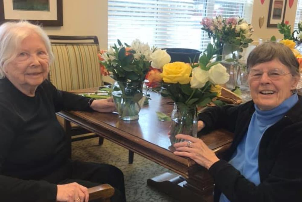 senior resident enjoying flower arrangements