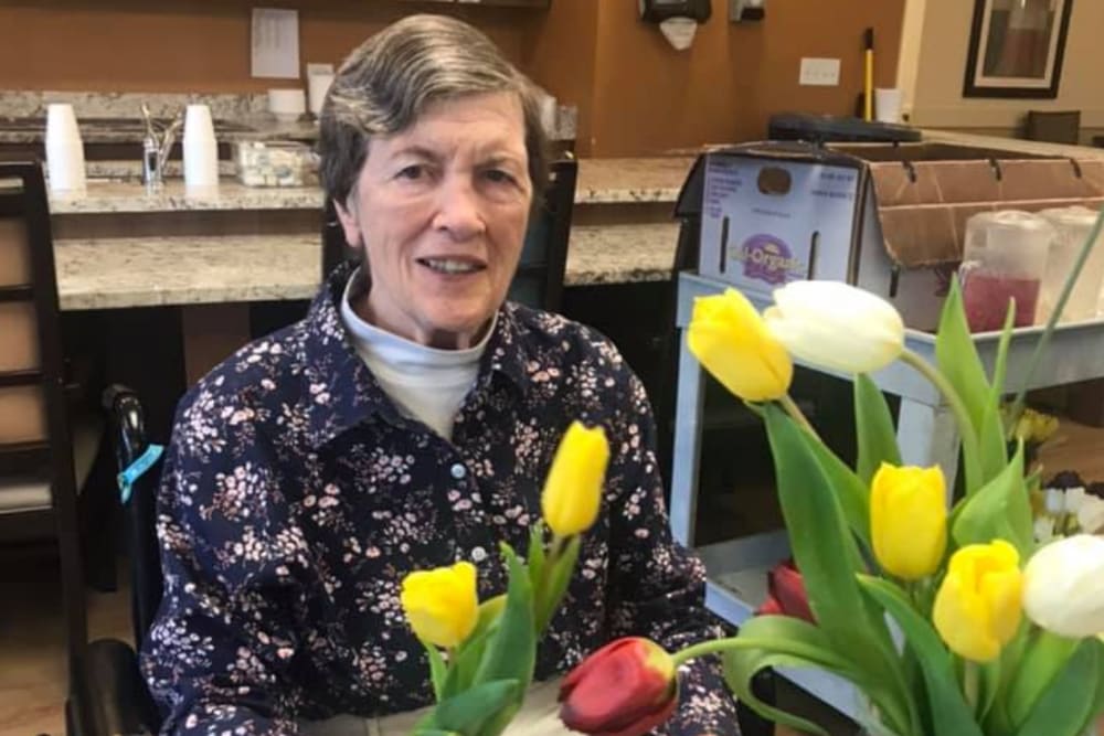 senior residents enjoying some flowers