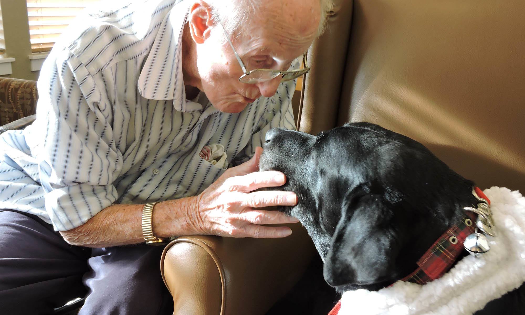 Resident with a dog at Greenridge Place