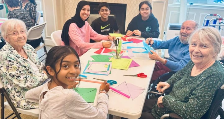 Residents and volunteers doing an art project