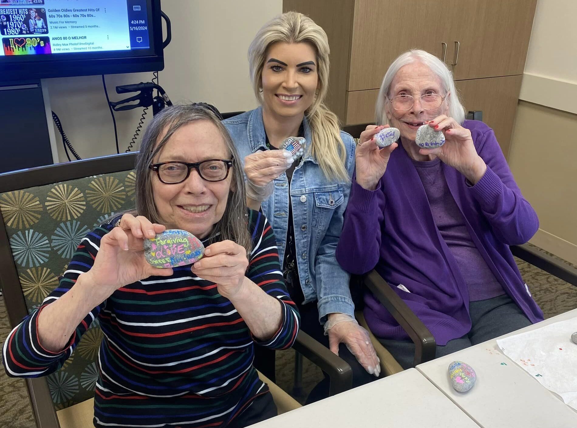 Emerald Place residents painting rocks