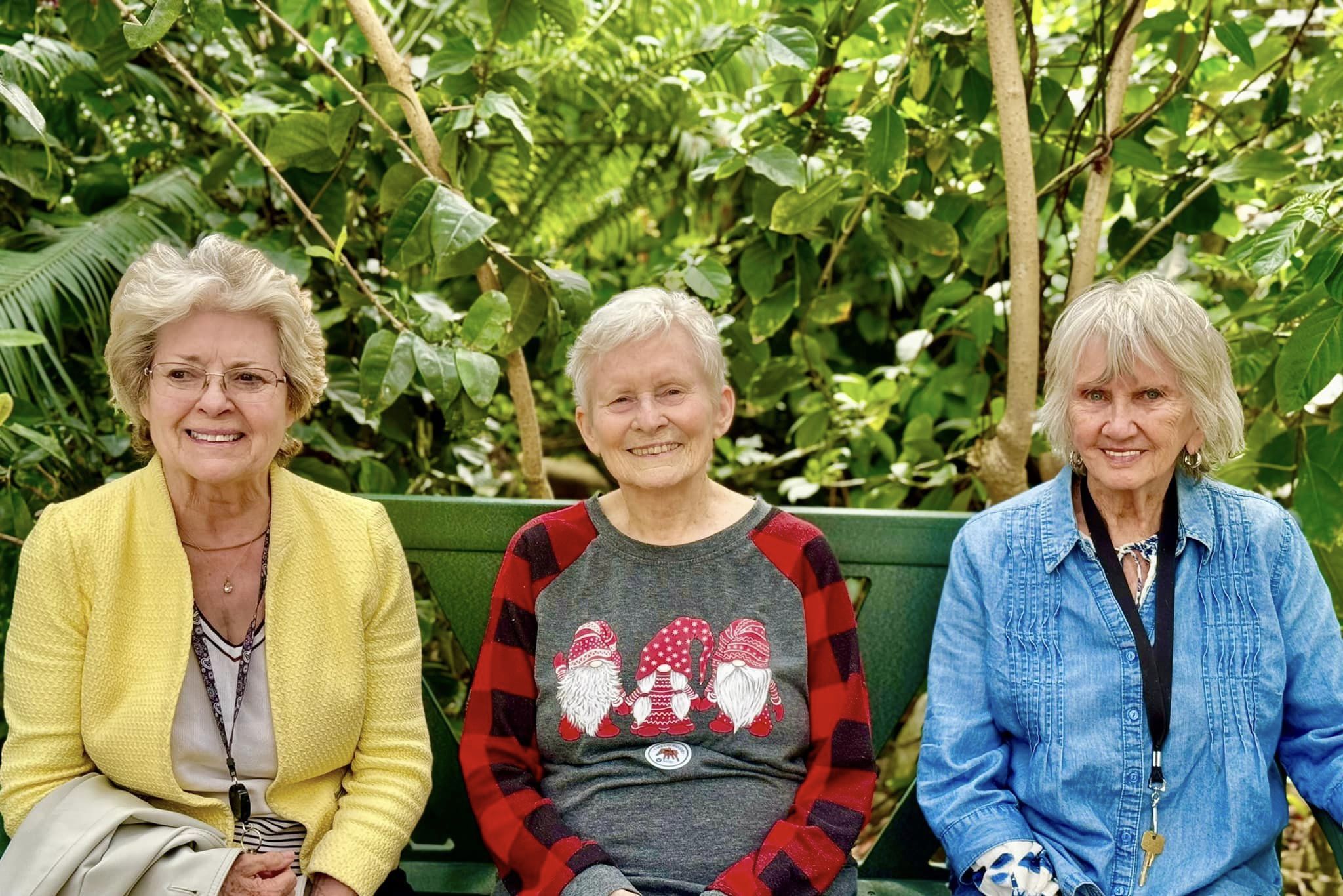 Three Willowbrook Place ladies sitting on a bench at a park