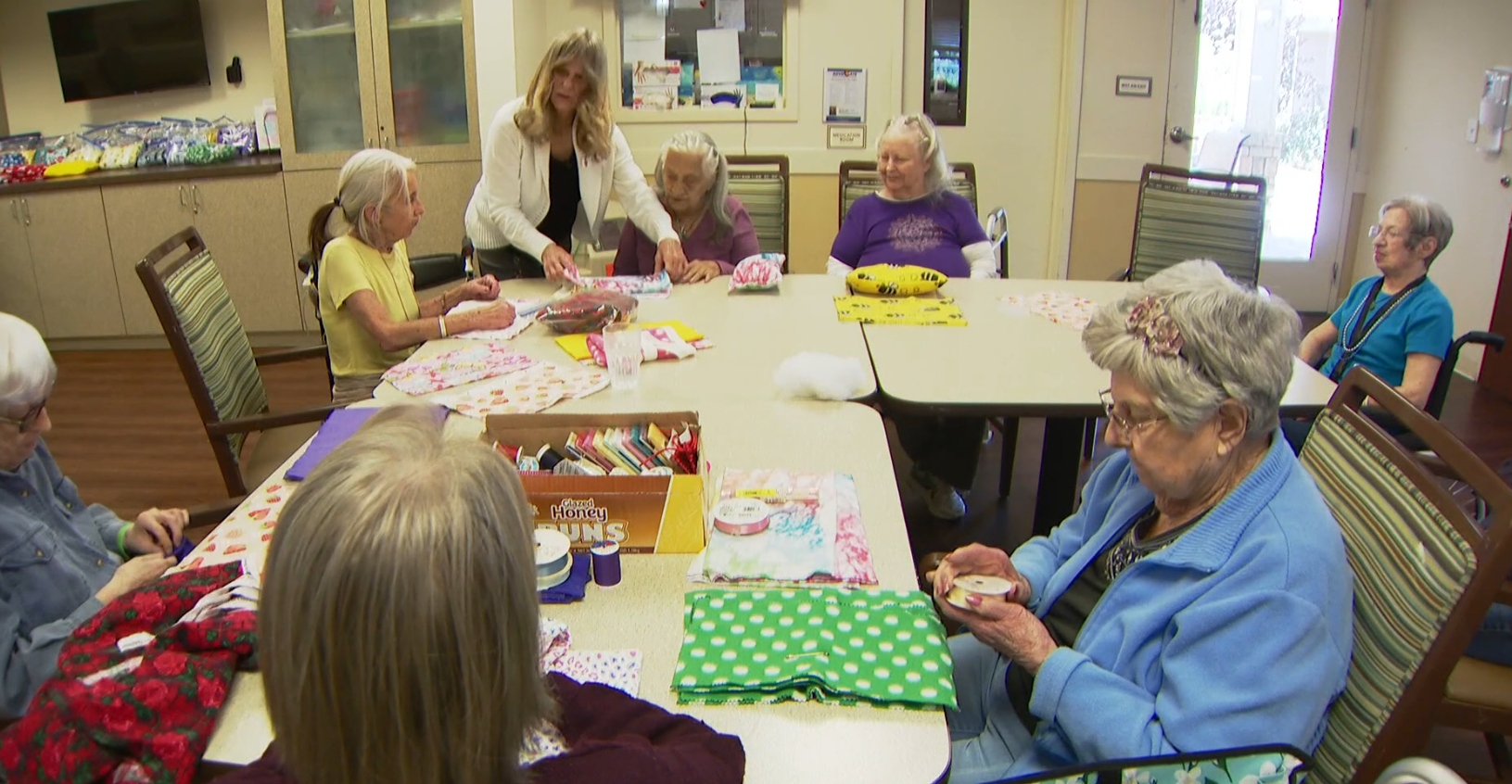 Greenridge Place Memory Care residents sew cushions for mastectomy patients - photo from KUSA TV video